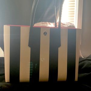 Kate spade tote. Almost new..beautiful bag with the pink attached wallet